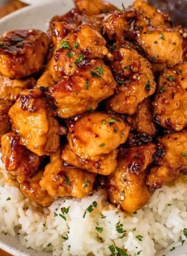 Honey Garlic Chicken Bites served on a plate with a side of vegetables