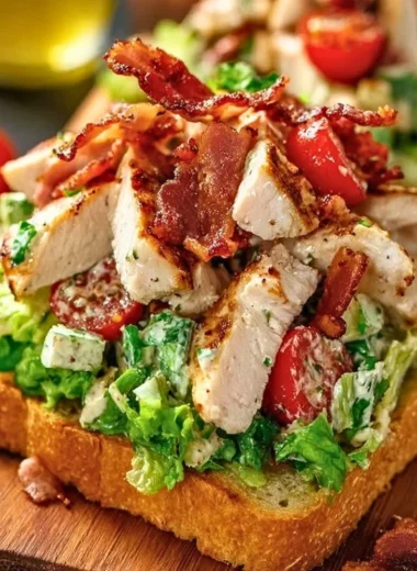 BLT Chicken Salad with chicken, bacon, lettuce, and tomatoes in a bowl