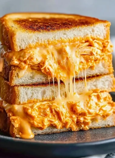 Buffalo Chicken Grilled Cheese Sandwich with melted cheese and spicy chicken