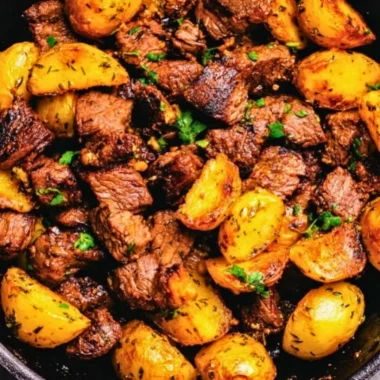 Delicious butter steak bites served with garlic herb potatoes on a plate