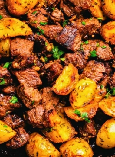 Delicious butter steak bites served with garlic herb potatoes on a plate