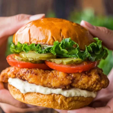 Crispy Chicken Sandwich with lettuce and sauce on a plate