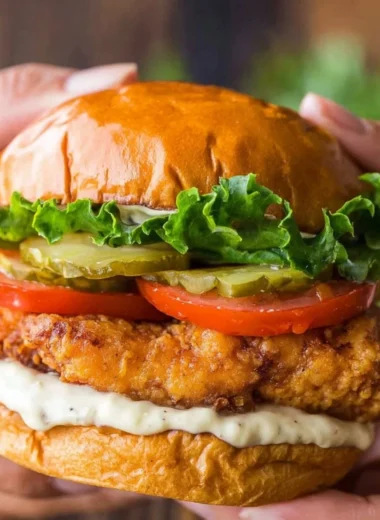 Crispy Chicken Sandwich with lettuce and sauce on a plate