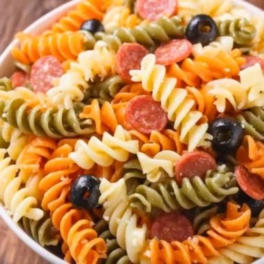 Bowl of Easy Italian Pasta Salad with vegetables and dressing