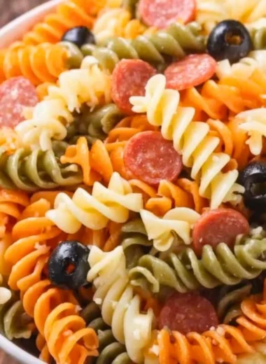 Bowl of Easy Italian Pasta Salad with vegetables and dressing