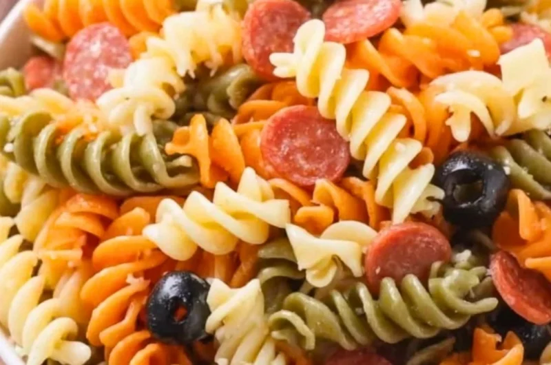 Bowl of Easy Italian Pasta Salad with vegetables and dressing