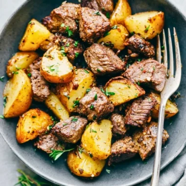 Delicious Garlic Butter Steak Bites served with roasted potatoes