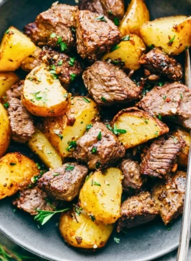 Delicious Garlic Butter Steak Bites served with roasted potatoes