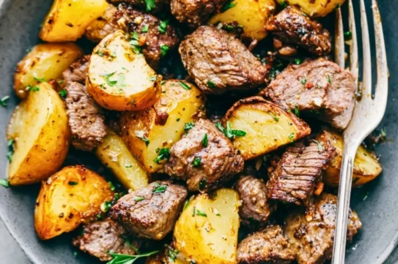 Delicious Garlic Butter Steak Bites served with roasted potatoes