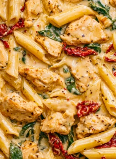 Delicious Marry Me Chicken Pasta garnished with herbs and pasta on a plate.