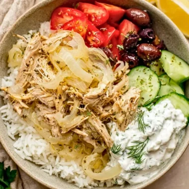 Slow cooker Greek chicken with herbs and vegetables ready to serve