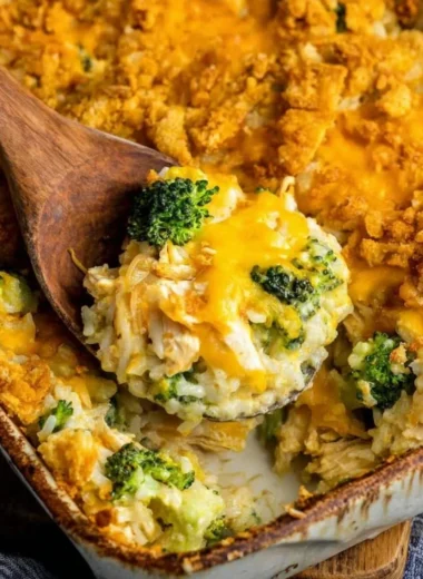 Broccoli cheddar chicken and rice casserole served in a baking dish