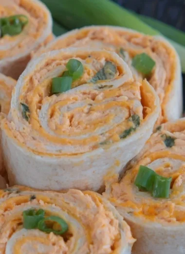 Buffalo Chicken Pinwheels with creamy filling and spicy sauce, perfect appetizer