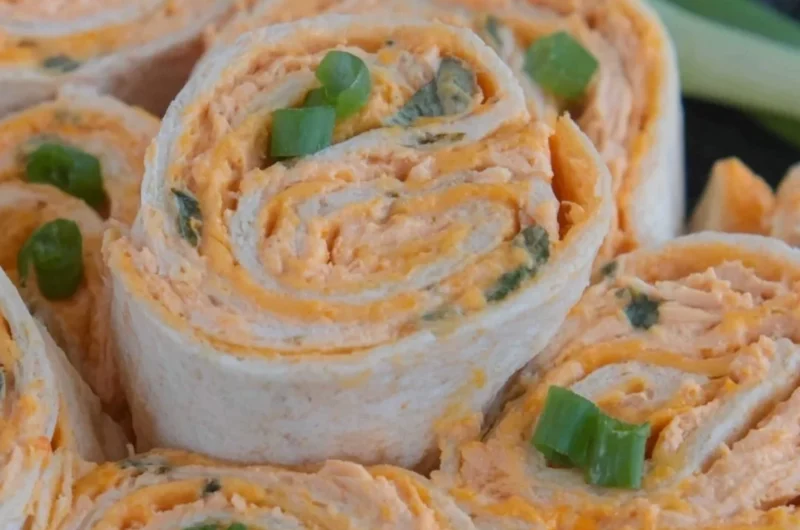 Buffalo Chicken Pinwheels with creamy filling and spicy sauce, perfect appetizer