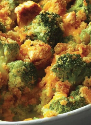Delicious broccoli chicken casserole ready to be served with a golden topping.