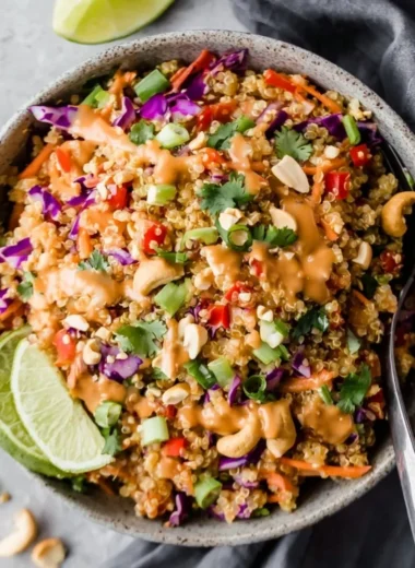 Crunchy Thai quinoa salad with creamy peanut ginger dressing served in a bowl