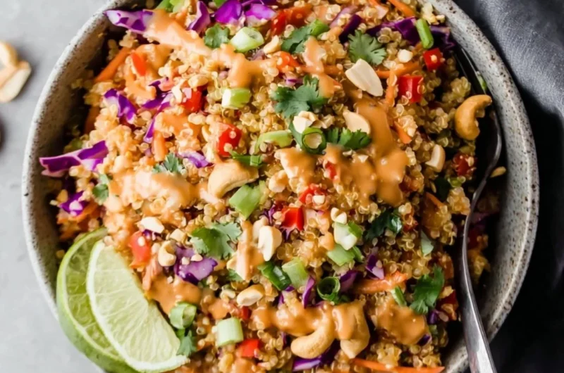 Crunchy Thai quinoa salad with creamy peanut ginger dressing served in a bowl