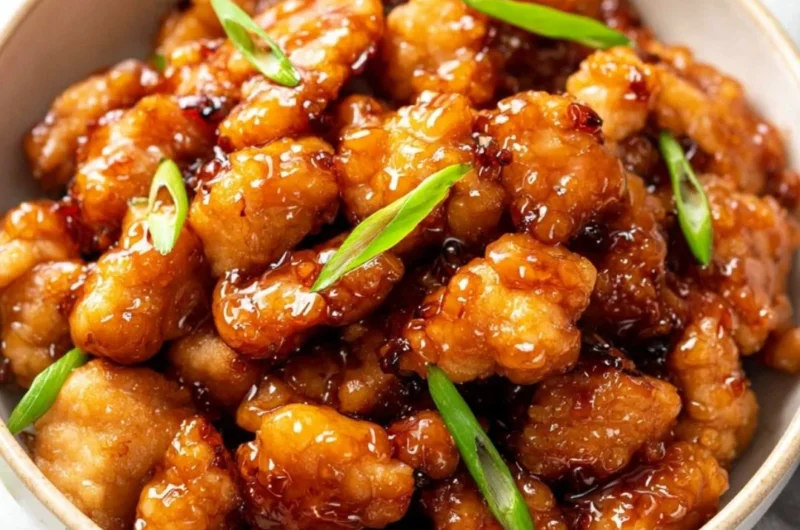 Delicious plate of honey butter chicken garnished with herbs