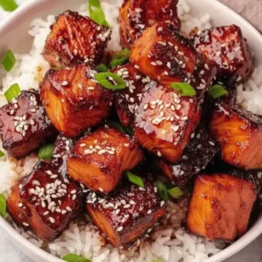 Honey garlic salmon bites bowl with fresh vegetables and rice