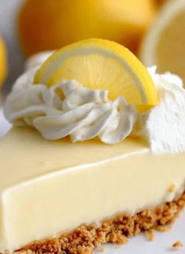 Delicious Magnolia lemon pie topped with whipped cream and lemon zest.
