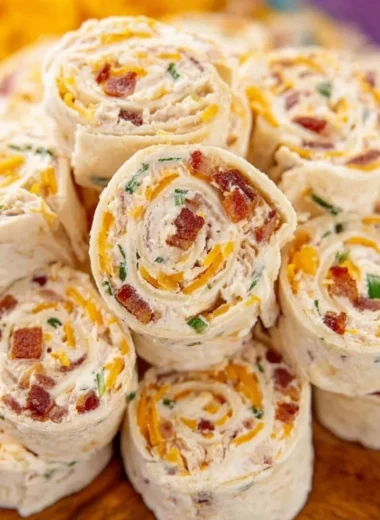 Delicious potluck pinwheels ready for a party or gathering.