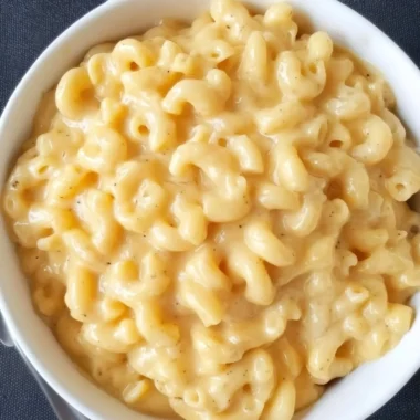 A creamy bowl of Simple Mac and Cheese topped with melted cheese