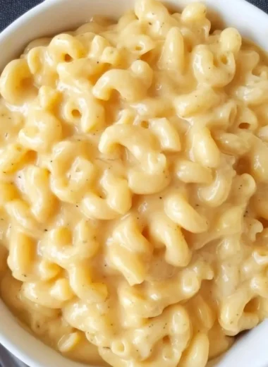 A creamy bowl of Simple Mac and Cheese topped with melted cheese