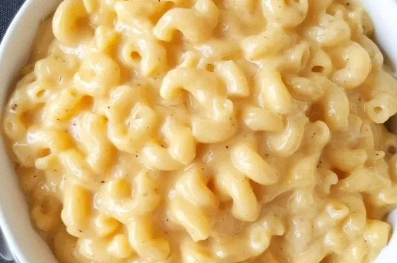 A creamy bowl of Simple Mac and Cheese topped with melted cheese