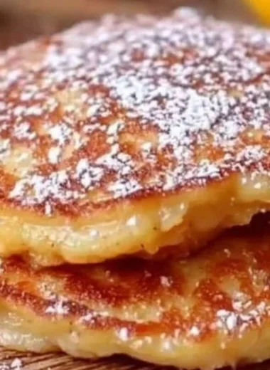 Fluffy apple yogurt pancakes stacked and ready to serve with syrup