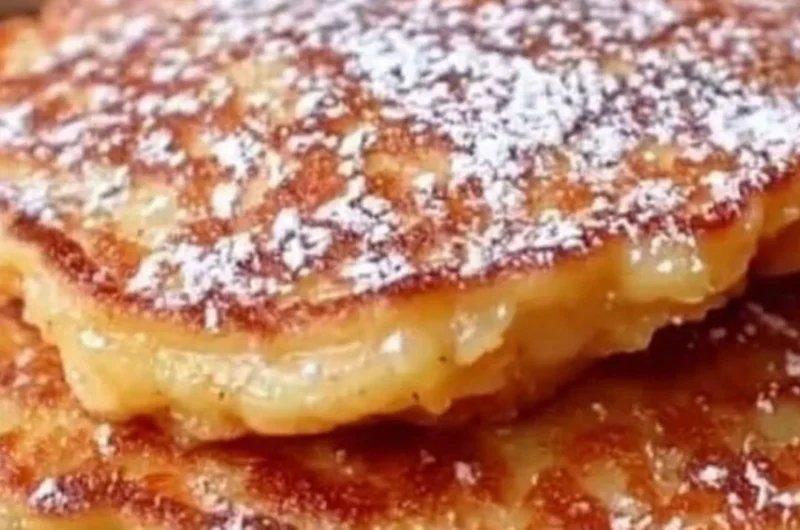 Fluffy apple yogurt pancakes stacked and ready to serve with syrup