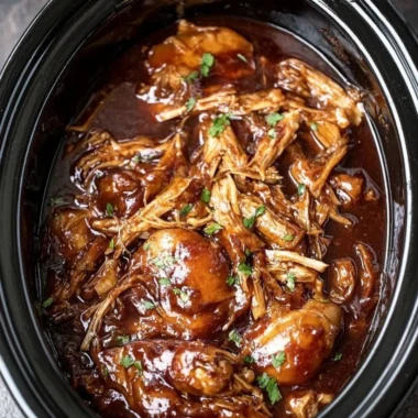 Delicious Crock Pot Bourbon Chicken served with rice and vegetables.