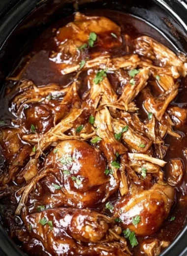 Delicious Crock Pot Bourbon Chicken served with rice and vegetables.