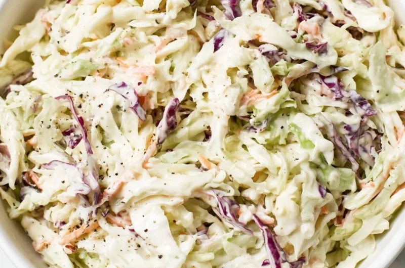 Delicious homemade coleslaw in a bowl with colorful cabbage and carrots
