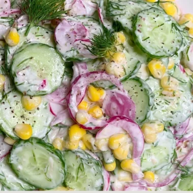 Colorful summer salad with fresh vegetables and herbs