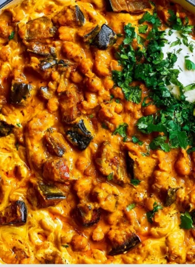 Cozy easy eggplant curry served in a bowl with herbs and spices