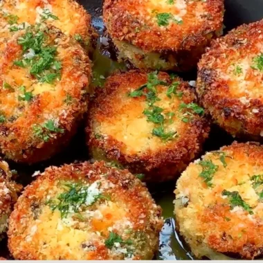 Plate of crispy breaded eggplant slices, golden brown and ready to serve