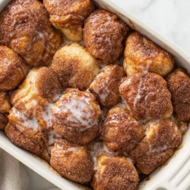 Delicious and easy monkey bread recipe with gooey cinnamon sugar pieces.