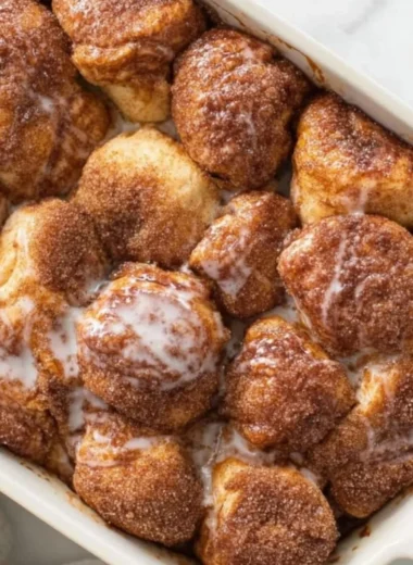 Delicious and easy monkey bread recipe with gooey cinnamon sugar pieces.