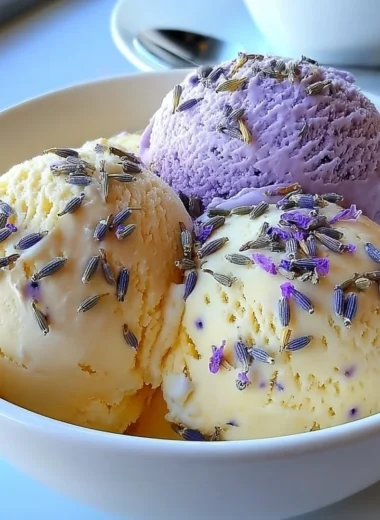 Creamy Lavender Honey Ice Cream with lavender sprigs and honey drizzle.
