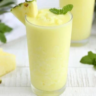 Delicious Pineapple Rum Slush served in a tropical setting.
