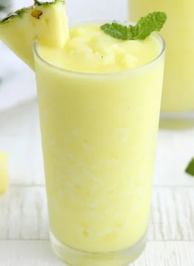 Delicious Pineapple Rum Slush served in a tropical setting.