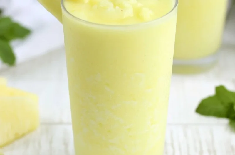 Delicious Pineapple Rum Slush served in a tropical setting.