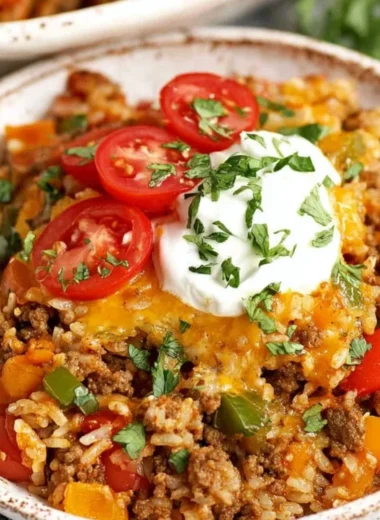 Delicious stuffed pepper casserole in a baking dish, topped with melted cheese.