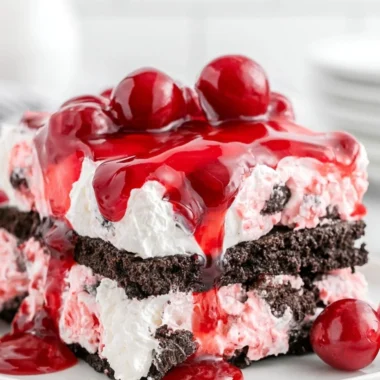Delicious Black Forest Icebox Cake layered with chocolate, cherries, and whipped cream