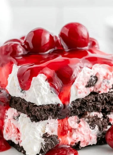 Delicious Black Forest Icebox Cake layered with chocolate, cherries, and whipped cream