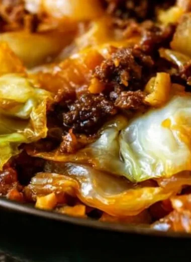 Savory dish of cabbage and ground beef served in a cozy setting