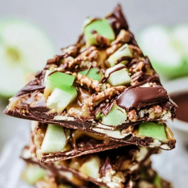 Delicious caramel apple bark pieces served on a cozy autumn-themed table.