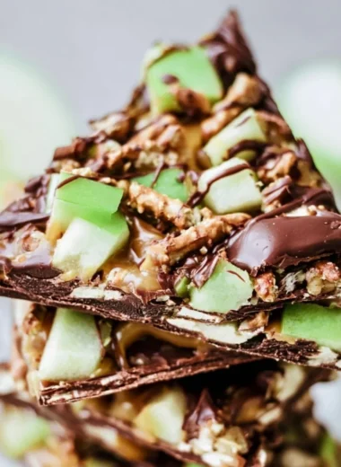 Delicious caramel apple bark pieces served on a cozy autumn-themed table.