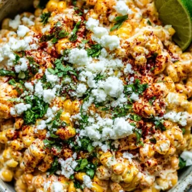 Cozy Mexican Street Corn Elote topped with cheese and spices