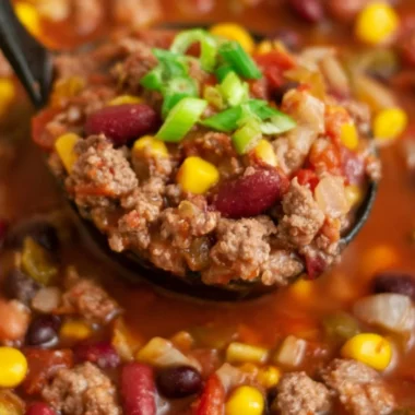Bowl of delicious Cozy Santa Fe Taco Soup topped with fresh cilantro and cheese